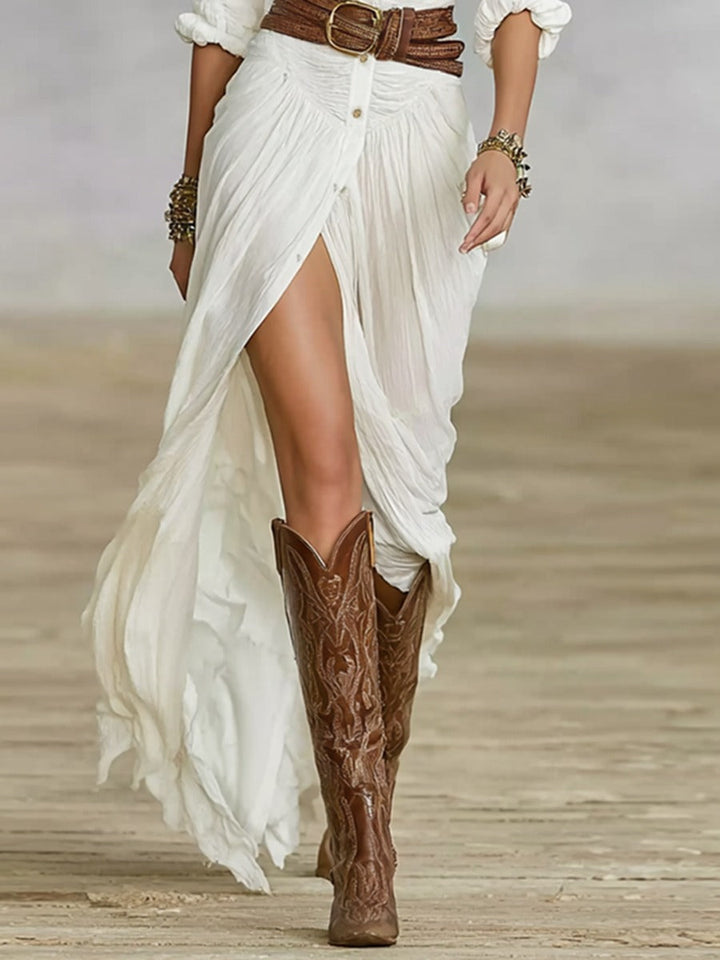 Robe longue ceinturée à revers plissés